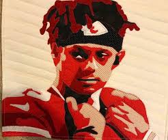 Statue in front of courthouse with Mahomes theme