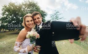 Wedding photography and mobile photography sound like they should never overlap. Wedding Couple Taking A Selfie Stock Photo Download Image Now Istock