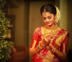 Kerala Hindu Wedding Hairstyles Pictures Sparkly Ornaments Wedding Saree Collection Kera In 2020 Kerala Bride Wedding Saree Collection Hindu Wedding