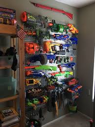 With a wire rack for the guns and baskets for the darts, there's no clear and present although some parents may toy with the idea of dumping nerf guns in a garbage bin. Aven S Room Kids Room Organization Diy Playroom Toy Rooms