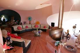 Resembling a terracotta cluster of soap bubbles, the aptly named palais bulles is situated on a rocky cliff on massif de l'esterel—a volcanic mountain range overlooking the mediterranean sea. Visit Pierre Cardin S Vacation Home The Bubble Palace