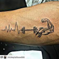 Why are weight lifting tattoos good for you? Look In The Mirror That S Your Competition Tattoo Done By Mickeytattoos666 Gym Gymtatt Fitness Tattoos Boxing Tattoos Arm Tattoos For Guys