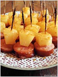Glazed kielbasa bites with pineapple are a simple appetizer or tailgating snack! Glazed Kielbasa Pineapple Bites