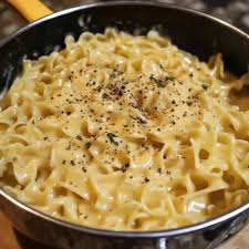 Cafeteria Noodles Ingredients: 12 oz egg noodles 4 tbsp butter 1 can (10.5  oz) condensed cream of chicken soup 2 cups chicken broth 1/2 tsp garlic  powder 1/2 tsp onion powder 1/2