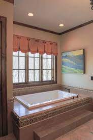 Adding a few steps can allow you to install a much deeper bathtub. Mountain Retreat Rustic Bathroom Charlotte By Durham Designs Consulting Llc Bathroom Remodel Master Bathrooms Remodel Bathroom Design Luxury