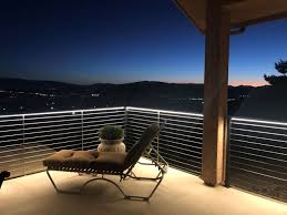 Their soft glow is ideal for lighting the surface below, making it easier to see and safer to navigate. 3528 Waterproof Strip Lights Are Used Under Railing Of An Outdoor Patio Ecolocity Led