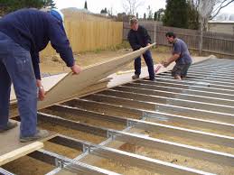 Floor Sheet Being Installed Over A Boxspan Steel Floor Frame Steel Frame House Steel Frame Construction Steel Frame