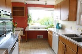 If you don't clean dishes that much one of the main reasons to have a kitchen sink under the window is so that one can have a great view while washing the dishes. Kitchen Remodel Update Sink Location Counters Under Window The Inspired Room