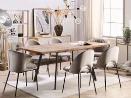 This dining room features black dining table and chairs that sit on a beige rug over hardwood flooring. Extendable Tables Up To 70 Off Beliani De