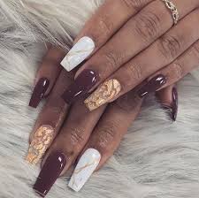 Burgundy Maroon White Marble And Gold Coffin Nails Maroon Nails Gold Nails Luxury Nails Marble nail art has become very popular.