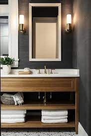 A White Beveled Mirror Contrasts A Bathroom Wall Covered In Black Grasscloth Wallpape Wallpaper Accent Wall Bathroom Bathroom Interior Bathroom Interior Design