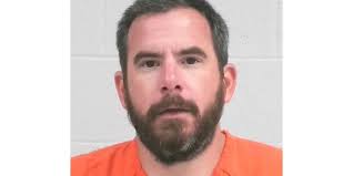 Advance man accused of shooting tires