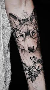 Black And Grey Wolf Tattoo 50 Of The Most Beautiful Wolf Tattoo Designs The Internet Has Ever Seen Wolf Tattoos For Women Grey Wolf Tattoo Wolf Tattoo Forearm