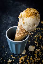 Vanilla Hazelnut Caramel Praline Ice Cream In A Cone On A Black Background Hazelnut Praline Praline Ice Cream Praline Recipe