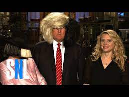 SNL Host Donald Trump Tries on Sia's Wig - YouTube