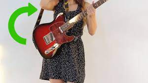 Make sure you thread the shoelace behind the nut and underneath the strings so that it doesn't get in the way while you play. 3 Ways To Put A Strap On A Guitar Wikihow