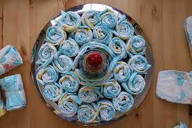 No baby shower is complete without a diaper cake, a gift that can also serve as a beautiful centerpiece. How To Make A Diaper Cake Alpha Mom