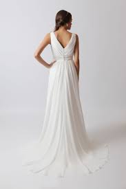 Melody A Simple Yet Elegant Gown The V Neck And Back Are Extremely Flattering And The Button Detail To The Wedding Dresses Gowns Of Elegance Puffy Dresses