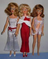 misty doll by ideal the clothing is a bit mixed up the white jumpsuit is correct for the doll its on but the center doll is tammy doll outfits vintage dolls