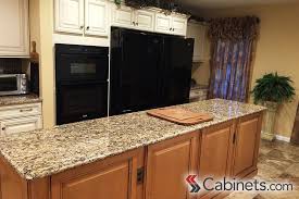 A Gorgeous Kitchen Island Made From Jupiter Maple Toffee Coffee Glaze Cabinets Island Black Appliances Kitchen Kitchen Two Tone Kitchen