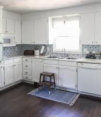 In the past, if you wanted to paint cabinets or furniture, you had to strip, sand and generally kill yourself getting a good surface ready to paint on. Painting Oak Cabinets White An Amazing Transformation Lovely Etc