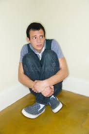 Scared Young man. A petrified young man sitting in the corner on the floor  of a , #spon, #man, #petrified, #Scared, #Young, #young #a… | Young man, Man,  Man sitting