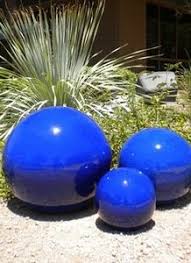Blue Garden Spheres I D Like Two To Nest In The Middle Of Clumps Of Golden Grass Like Eggs In A Nest Garden Spheres Blue Garden Garden Ornaments