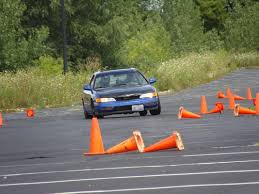 Many people hastily park their cars in parking spots by driving into them rather than backing in. Parking Lot Autocross