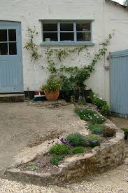 Geranium Ballerina Helianthemum Wisley White And Alpine Planting Soften This Hollow Wall Garden Design Plants Geraniums