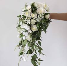 This unique wedding bouquet really catches the light. Romantic Wedding Cascading Bouquet Bouquet Draping Bridal Rose Bouquet White Rose Cascade Bouquet Realistic Silk Flower Bridal Bouquet In 2021 Bridal Bouquet Flowers White Roses Wedding Green Wedding Bouquet