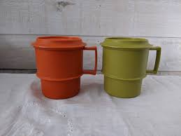 Set Of 2 Vintage Tupperware Coffee Mugs With Lids Coasters Orange And Green By Hazelskidesigns On Etsy Vintage Tupperware Tupperware Coffee Mugs