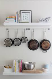 Short On Space Stylish Ways To Store Pots Pans Kitchen Hacks Organization Small Kitchen Storage Solutions Small Kitchen Solutions