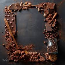  Frame Of Chocolates Frame Of Different Chocolates And Sweets On Wooden Spoons On A Dark Background Chocolate Cube Baking Wallpaper Chocolate