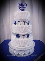 Check spelling or type a new query. 3 Tier Pleated Wedding Cake White Royal Blue Sugar Roses With Diamonte Ribbon Royal Blue Wedding Cakes Wedding Cakes Blue Dream Wedding Cake