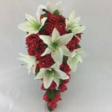 They specialize in classic, romantic designs, ideally suited for rustic weddings. Tiger Lily Rose Bouquet Village Green