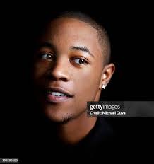 Portrait Of A Young Man On A Black Background High-Res Stock Photo