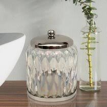 I love to use all kinds of bins for storage. Glass Cotton Ball Holder Wayfair