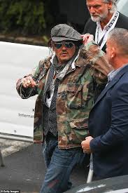 The pirates of the caribbean actor was greeted by fans at the airport before walking the red carpet for the event. Jnztjrcwtbat3m