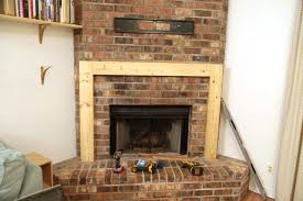 The large 8 by 8 cut of wood makes a perfect statement piece to hang over a fireplace. Diy Simple Painted Mantel