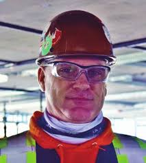 When Does a Building Under Construction Technically Become 'Indoors'?