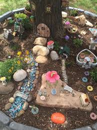 Miniature Fairy Garden Under A Tree A Means Of Not Overloading Small Garden Spaces Is The Monochrome D In 2020 Fairy Garden Miniature Fairy Gardens Fairy Garden Diy