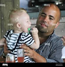 Former number one professional tennis player Boris Becker and his wife  Sharlely 'Lilly' Kerssenberg Becker enjoy a relaxing lunch at their luxury  hotel with friends and their baby son Amadeus Benedict Edley