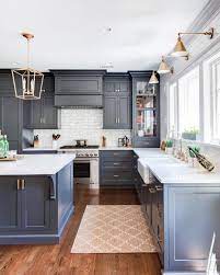 Modern farmhouse kitchen with open shelving navy blue cabinetry. 25 Inviting Blue Kitchen Cabinets To Have