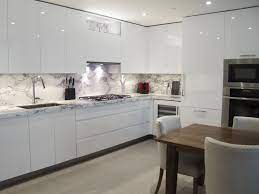 We offer colours from a stunning white to a sophisticated modern grey. Custom Kitchen Design White High Gloss Handle Less Cabinetry With Marble Countertops And Ba Encimeras De Cocina Cocinas Blancas Modernas Decoracion De Cocina