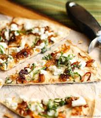 An Easy Flatbread Appetizer Simply Dressed With Caramelized Onions Fresh Basil And Goat Cheese Flatbread Appetizers Food Appetizer Recipes