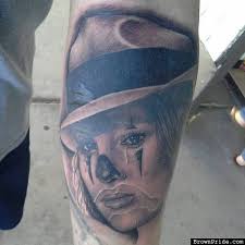 When it comes to gangster tattoos, men choose to incorporate everything from the iconic tommy gun to vintage ford model 18, and of course, styles that represent an artistic spirit for the art of bootlegging. 21 Gangsta Clown Tattoos And Designs
