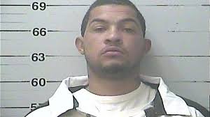 Who are the four men arrested in the deadly Pass parade shooting?