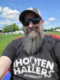 Wearing band t-shirts to promote Hooten Hallers at ROMP festival in  Owensboro Kentucky