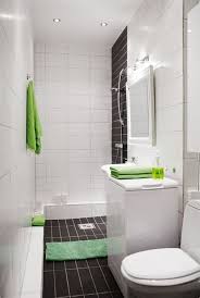 The large tilework creates the illusion of higher, wider ceilings and works perfectly with the neutral wood accents. Awesome Bathrooms Shefalitayal