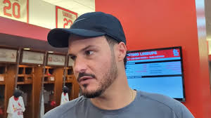 'We stayed with it. We didn't give in,' Nolan Arenado says of Cardinals'  comeback vs. Reds